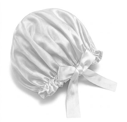 White silk bonnet with a ribbon on a white background